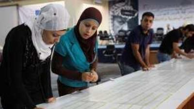 Workers of the Fatah election committee count votes in Bethlehem yesterday.