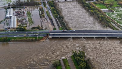 Flooding causes part of a road to collapse after heavy rain in Coimbra, Portugal. EPA