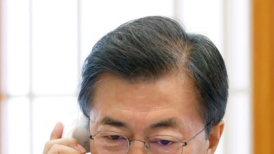 South Korean president Moon Jae-in is seen talking to his US counterpart, Donald Trump, in a telephone conversation at the presidential office in Seoul on September 17, 2017. South Korean Presidential Office Handout / EPA