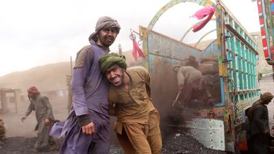 Miners pose for a pictures on International Workers' Day at a coal mine in Quetta, Pakistan. EPA