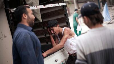 The Syrian war takes no pity on the young or old as shown here with a Syrian youth crying next to a lorry holding the body of his little brother.