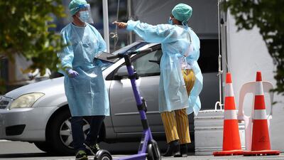 Nurses interact at a pop-up Covid-19 testing station at Wynyard Quarter carpark in the CBD in Auckland, New Zealand. Getty Images