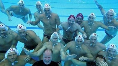 Hungarian national water polo coach Denes Kemeny, centre, has kept together the team he formed for the Games in 2000.
