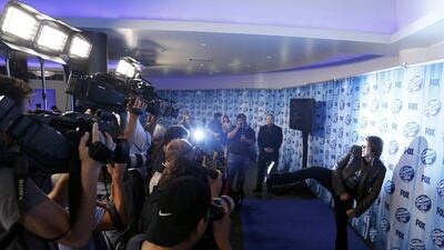 Winner Caleb Johnson poses for photographers backstage at the American Idol XIII 2014 finale on May 21, 2014. Danny Moloshok / Reuters