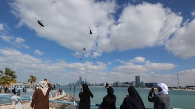 The flight of military helicopters on Saturday's Day of Solidarity parade against the Abu Dhabi skyline