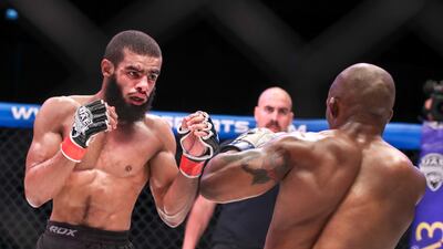 Muhidin Abubaker, right, exchange blows with Luthando Biko in the flyweight bout at UAE Warriors 32 Africa 3 held at the Etihad Arena, Yas Island in Abu Dhabi on September 17, 2022. Victor Besa / The National