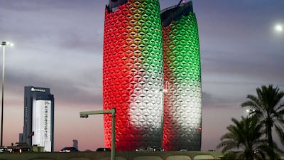 Al Bahr Towers in Abu Dhabi are lit up to mark the UAE's 51st National Day. Their innovative design and unique dynamic modular shading system provides self-shading as the Sun moves around the building. Khushnum Bhandari / The National