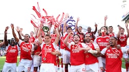 LONDON, ENGLAND - MAY 24: Martin Odegaard of Arsenal lifts the Premier League trophy as players of Arsenal celebrate, as they are crowned the Champions of the Premier League for the 2025/26 Season, after the Premier League match between Crystal Palace and Arsenal at Selhurst Park on May 24, 2026 in London, England. (Photo by Michael Regan / Getty Images For Premier League)