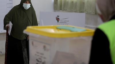 A woman arrives to cast her vote during parliamentary elections in Amman. Reuters