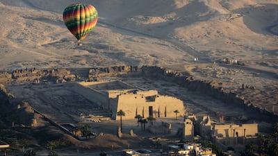 Egyptian authorities suspended hot air ballooning over the ancient city of Luxor after two tourists were lightly injured during a ride early on Monday. AP