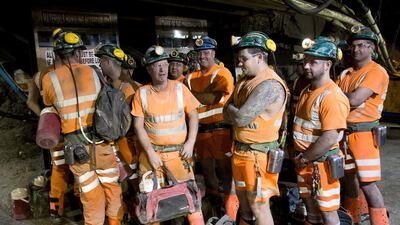 Miners wait for the cage that will transport them back to the surface at the end of their shift at the Cleveland potash mine. Ian Forsyth / Getty Images