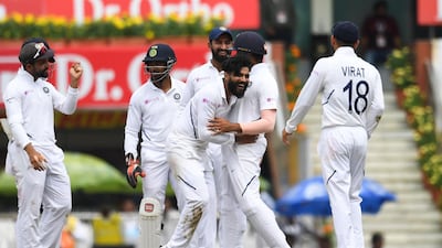 India bowler Ravindra Jadejam, centre, celebrates with teammates after bowling out South Africa's Heinrich Klaasen. AFP