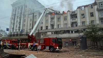 Ukrainian rescuers at the site of a rocket attack on a residential building in Dnipro, south-eastern Ukraine. EPA