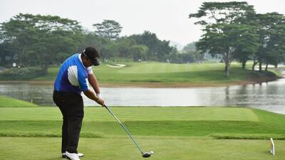 Kiradech Aphibarnrat of Thailand plays a shot during the third round of the Shenzhen International at Genzon Golf Club on Saturday. Stuart Franklin / Getty Images / April 18, 2015