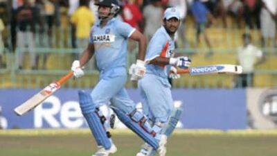 The Indian batsmen Suresh Raina, left, and Mahendra Dhoni run between wickets in the fourth one-day international against Sri Lanka.