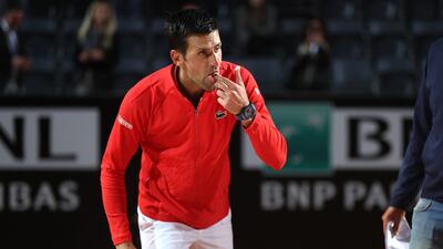 Novak Djokovic is presented with a cake after his 1000th career win following victory in the Italian Open semi-final. Getty
