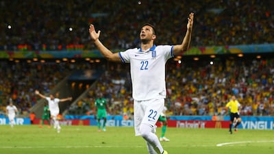 Andreas Samaris of Greece celebrates scoring his team's first goal against Ivory Coast on Tuesday at the 2014 World Cup. Michael Steele / Getty Images