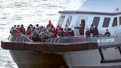 Migrants are taken to Dover, Kent, from the English Channel on October 9. PA