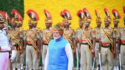 India's Prime Minister Narendra Modi inspects the guard of honour to mark the country's Independence Day, at the Red Fort in New Delhi. AFP