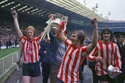 Mike Horswill, left, and goalscorer Ian Porterfield celebrate Sunderland's FA Cup final victory over Leeds United in 1973.