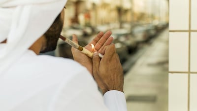 Smoking dokha from a medwakh pipe is harmful but hugely popular in the Gulf. Christopher Pike / The National