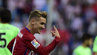 Atletico Madrid's Antoine Griezmann celebrates after scoring one of his two goals against Getafe on Tuesday in his team's La Liga victory. Javier Soriano / AFP / September 22, 2015