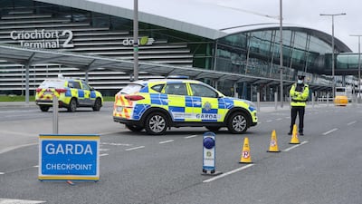 Police carry out Covid-19 stop checks outside Dublin Airport with people arriving from certain countries required to enter hotel quarantine. Alamy