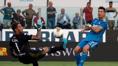 Parma's goalkeeper Luigi Sepe, left, makes a save from Ronaldo. AP Photo