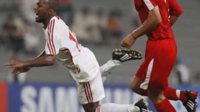 Ismael Matar falls to the ground during the 2010 FIFA World Cup qualifiers at Sheikh Mohammed Bin Zayed Stadium.