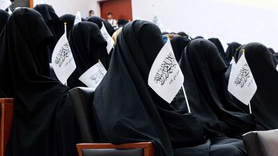 Afghan women listen to speakers before a pro-Taliban rally outside the Shaheed Rabbani Education University in Kabul. EPA