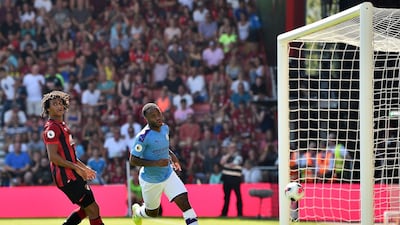 Manchester City's Raheem Sterling wheels away in celebration after making it 2-0. AFP