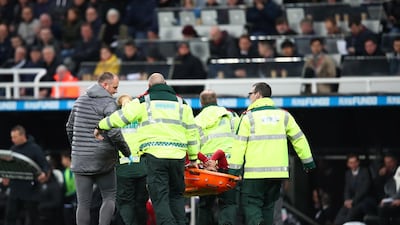 Salah is carried off the pitch on a stretcher. Clive Brunskill / Getty Images