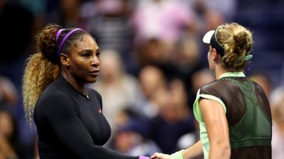 Serena Williams shakes hands with Catherine McNally following her 5-7, 6-3, 6-1 victory. AFP