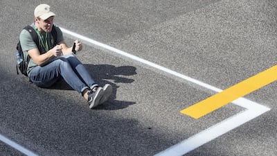 A fan on the track during previews for the Abu Dhabi Formula One Grand Prix at Yas Marina Circuit in Abu Dhabi on November 23, 2017. Christopher Pike / The National