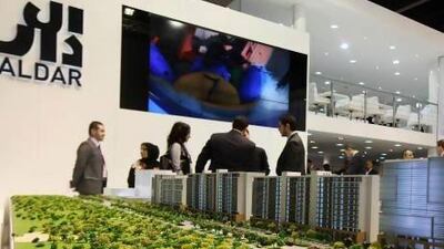 Property firms outperformed other sectors on the ADX following the merger of Aldar and Sorouh. Pawan Singh / The National