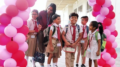 Pupils are welcomed to Gems New Millennium School in Dubai for the first day of the academic year. Pawan Singh / The National