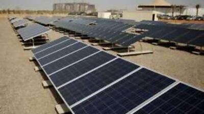 Solar panels power offices at the construction site of Masdar city.