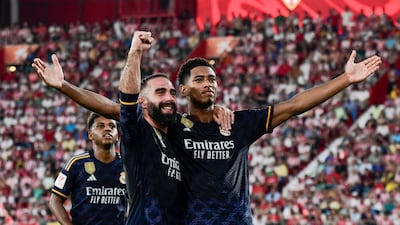 Real Madrid's Jude Bellingham, right, celebrates after scoring against Almeria at Power Horse Stadium on August 19, 2023. EPA
