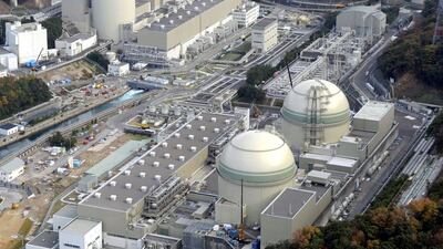 The Number 4 (front L), Number 3 (front R), Number 2 (rear L) and Number 1 reactor buildings at Kansai Electric Power's Takahama nuclear power plant in Japan. A court has overturned a ban meaning two of the reactors can be restarted. Kyodo / Reuters
