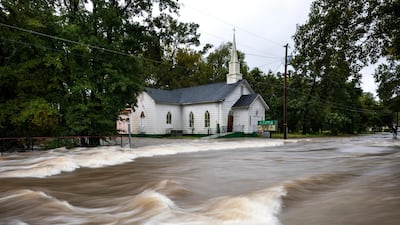 Floodwaters from Hurricane Florence rush down Cool Spring Street, inundating the St James Church in Fayetteville, North Carolina. EPA