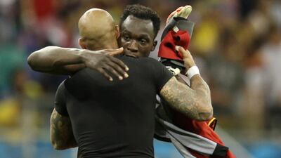Tim Howard and Romelu Lukaku embrace following the Lukaku and Belgium's win over Howard and the United States on Tuesday at the 2014 World Cup round of 16. Natacha Pisarenko / AP