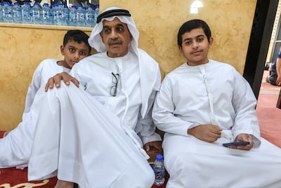 Emirati worshipper Hussain Gafan visits Omar bin Al Khattab mosque with his sons to perform the rain prayers. Victor Besa / The National