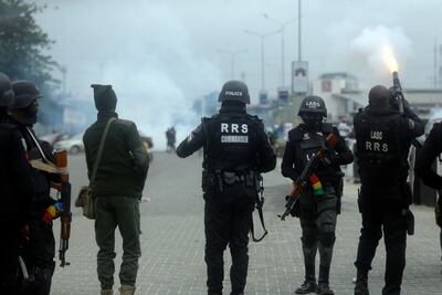 Policemen dispersed protesters with tear gas following a demonstration at Lekki Toll plaza in Lagos Nigeria Wednesday, Oct. 20, 2021. Nigerian police officers fired tear gas at protesters in Lagos, the country's largest city, as they tried to disperse hundreds of people demonstrating against police brutality on Wednesday. One year ago, thousands marched in Nigeria for the #EndSARS movement to protest the activities of the now-disbanded Special Anti-Robbery Squad, a unit accused of police brutality. (AP Photo / Sunday Alamba)