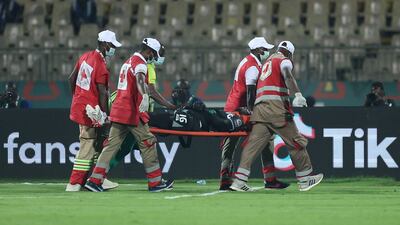 Burkina Faso goalkeeper Herve Kouakou Koffi is carried off after his collision with Cheikhou Kouyate. AFP