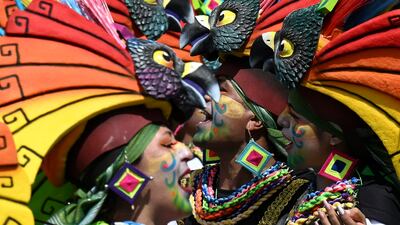 Revellers take part in the Chant to the Earth parade during the Carnival of Blacks and Whites in Pasto, Colombia. AFP