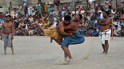 Wrestlers in Karachi, Pakistan, compete in a Sindhi Malakhra match, an ancient form of wrestling. AFP