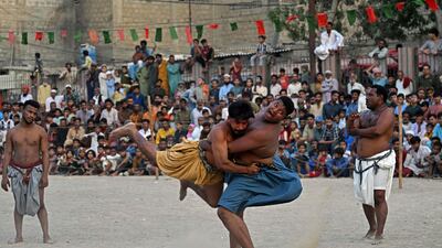 Wrestlers in Karachi compete in a Sindhi Malakhra match, an ancient form of wrestling that originated in Pakistan's Sindh region. AFP