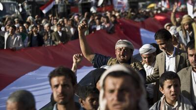 Supporters of Houthi Shiites shout slogans while marching on a street as they celebrate the fourth anniversary of the uprising in Sanaa, Yemen, Wednesday, Feb. 11, 2015. The United States, Britain and France moved to close their embassies in Yemen on Wednesday, increasing the isolation of Shiite rebels who have seized power. (AP Photo/Hani Mohammed)