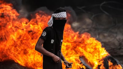 A Palestinian protester during clashes after Friday protests near the border with Israel in eastern Gaza City. Mohammed Saber / EPA