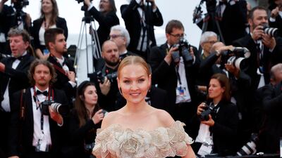 Actor Stefaniya Makarova wears an off-the-shoulder, champagne gown. EPA
